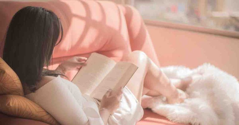 Woman Reading on Couch