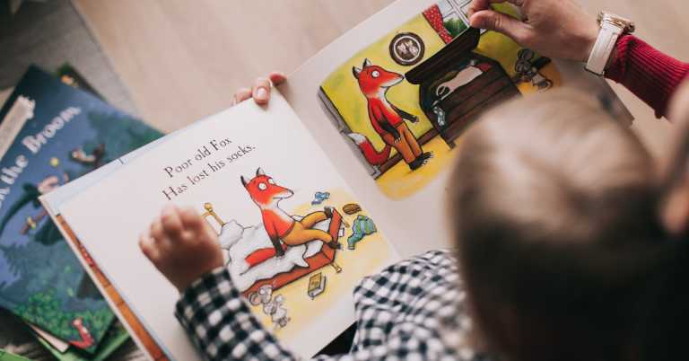 child reading a book as seen from above